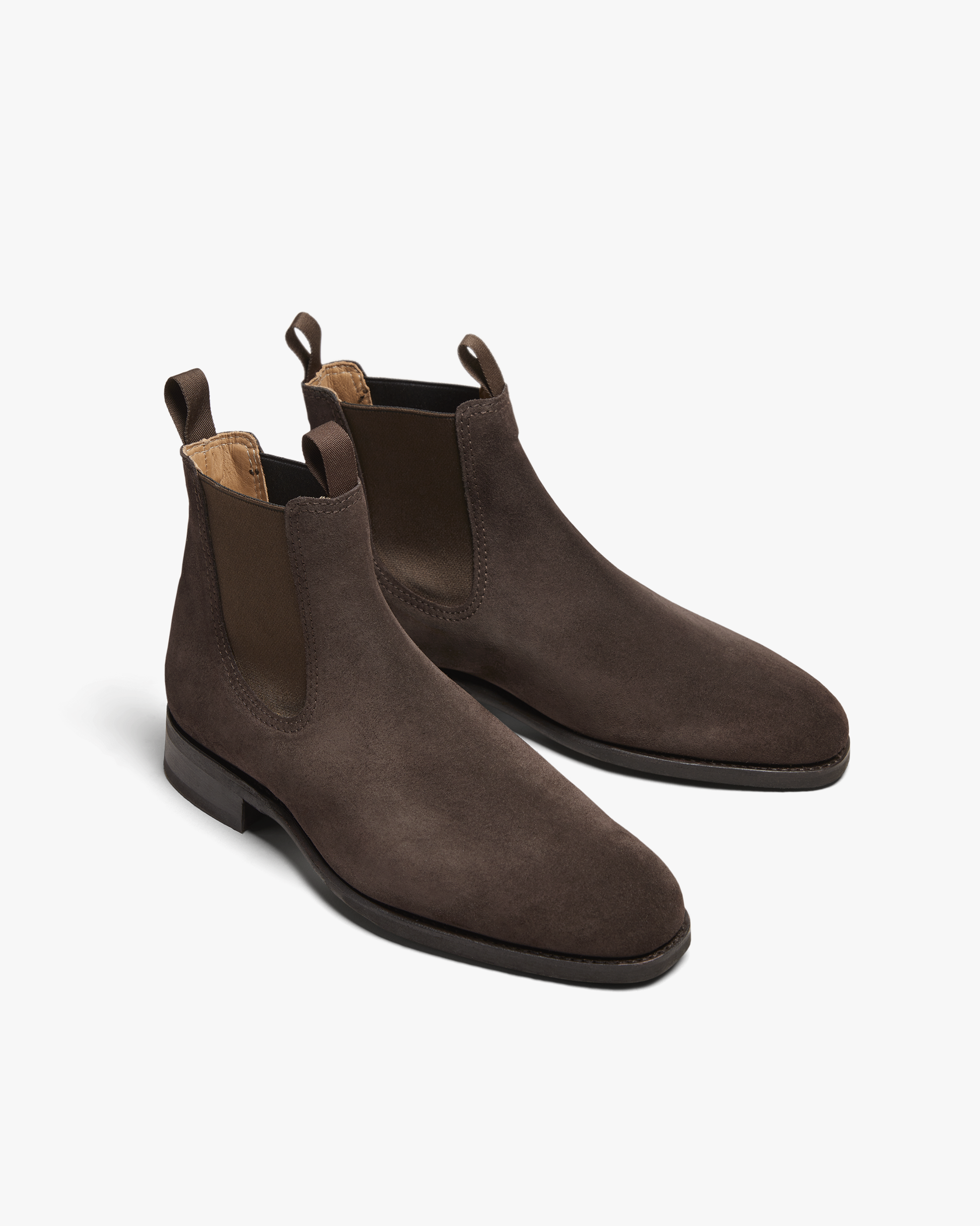 A pair of Granhult – Dark Brown Suede Chelsea boots on a white background.
