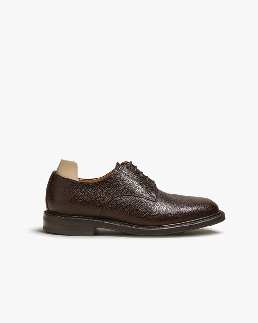 A side profile of Boden – Dark Brown Country Calf, detailing its grained leather and classic Derby silhouette.