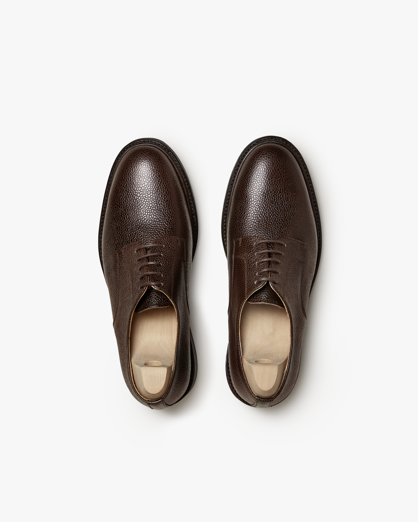 Top-down studio shot of the Boden – Dark Brown Country Calf Derby shoes, showing the rich, grained leather texture.