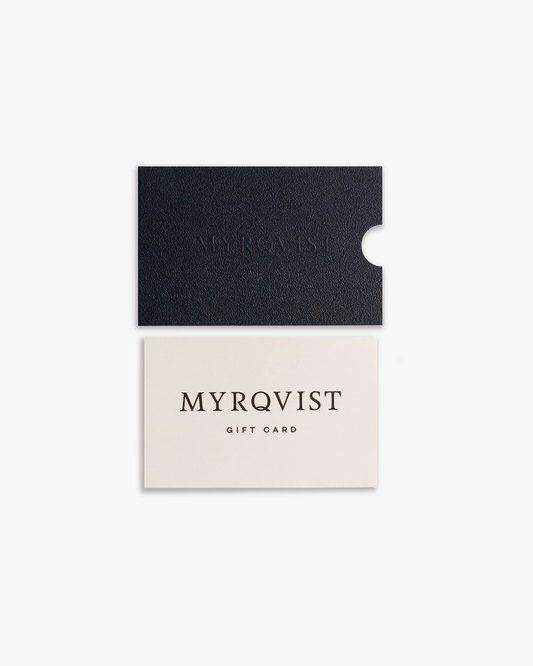 Myrqvist digital gift card displayed with its textured, dark navy sleeve against a white background.