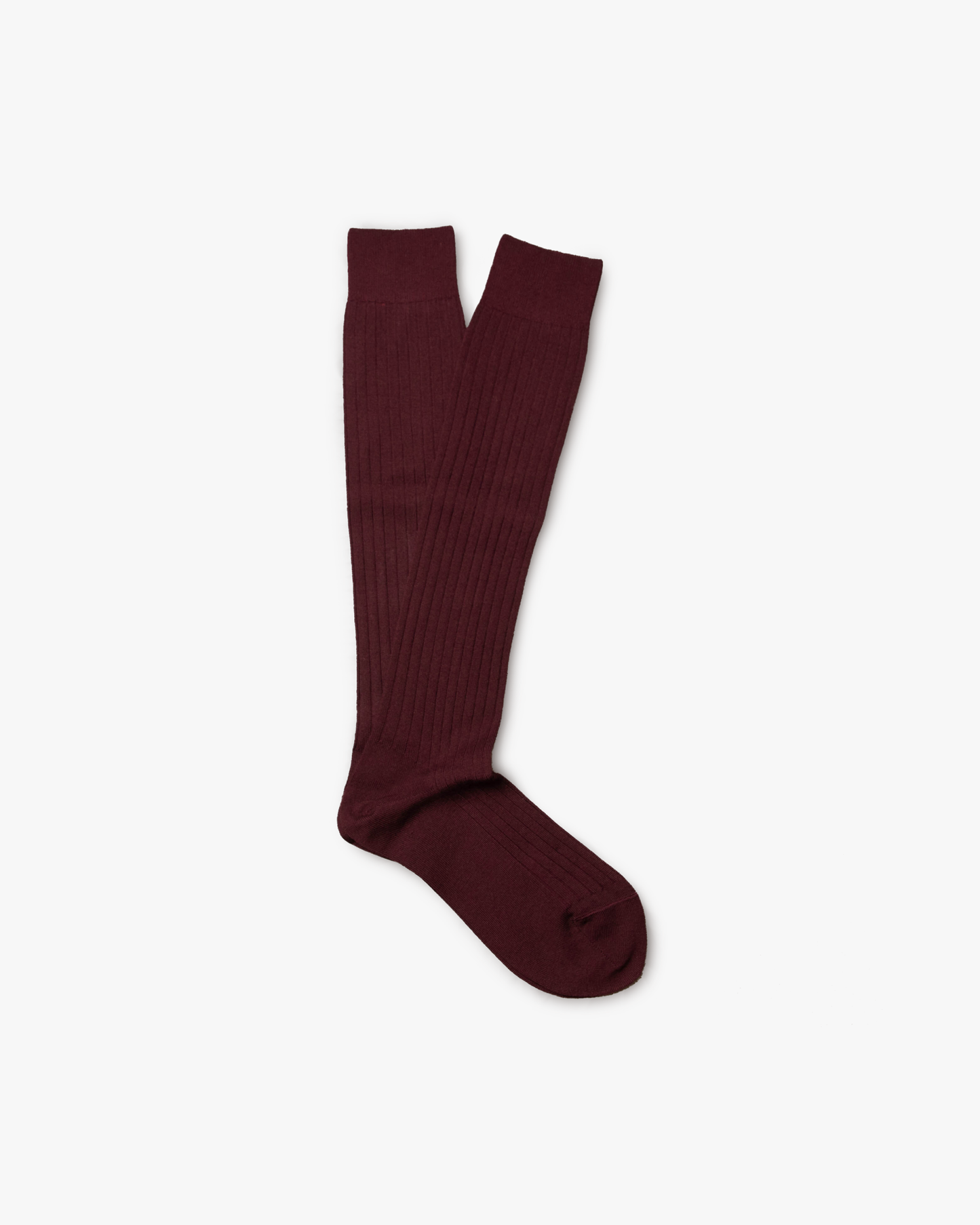 A pair of Gustav – Knee-High Merino Socks in burgundy, laid flat on a white background.