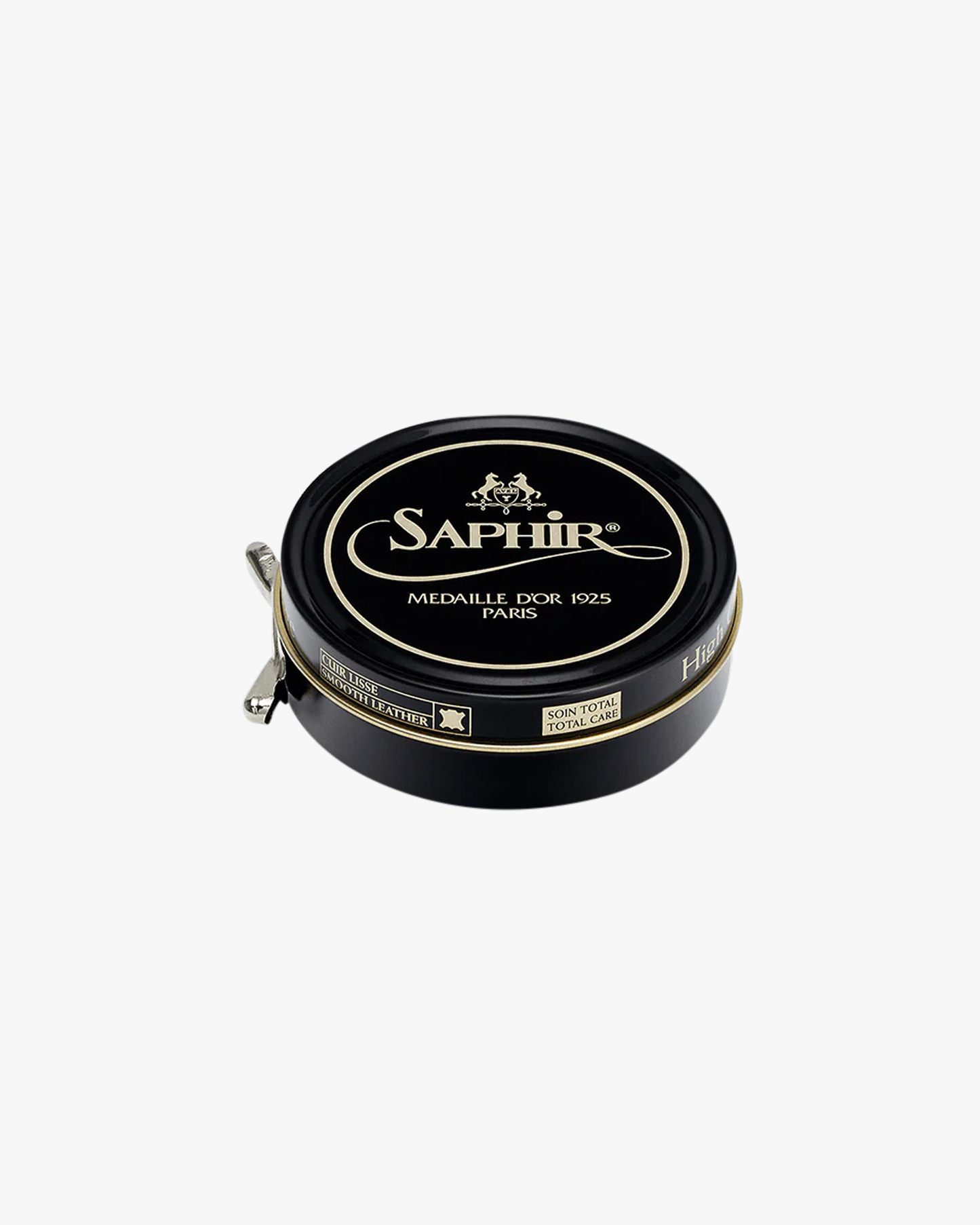A black and gold tin of Saphir – Pâte de Luxe shoe wax, photographed on a white studio background.