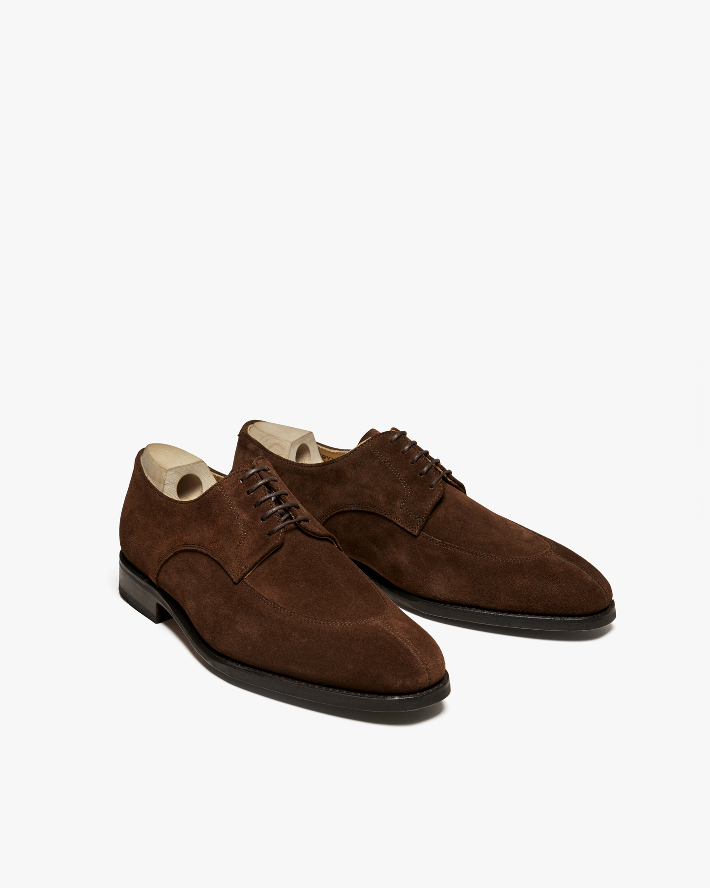 A pair of Norrmalm – Dark Snuff Suede split-toe derby shoes, shown from an angle against a white background.