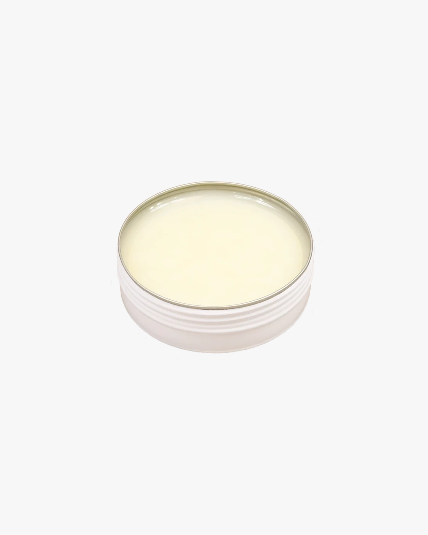 A close-up of the Saphir – Pâte de Luxe – Neutral shoe wax, shown in its open 50 ml tin.