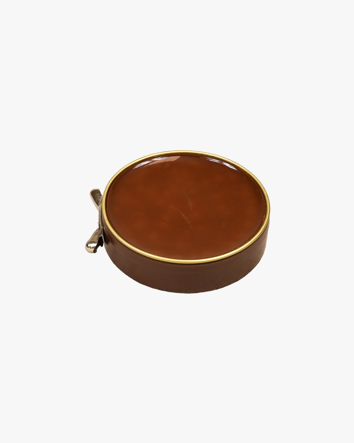 An open tin of Saphir – Pâte de Luxe shoe wax in light brown, shown on a plain white background.