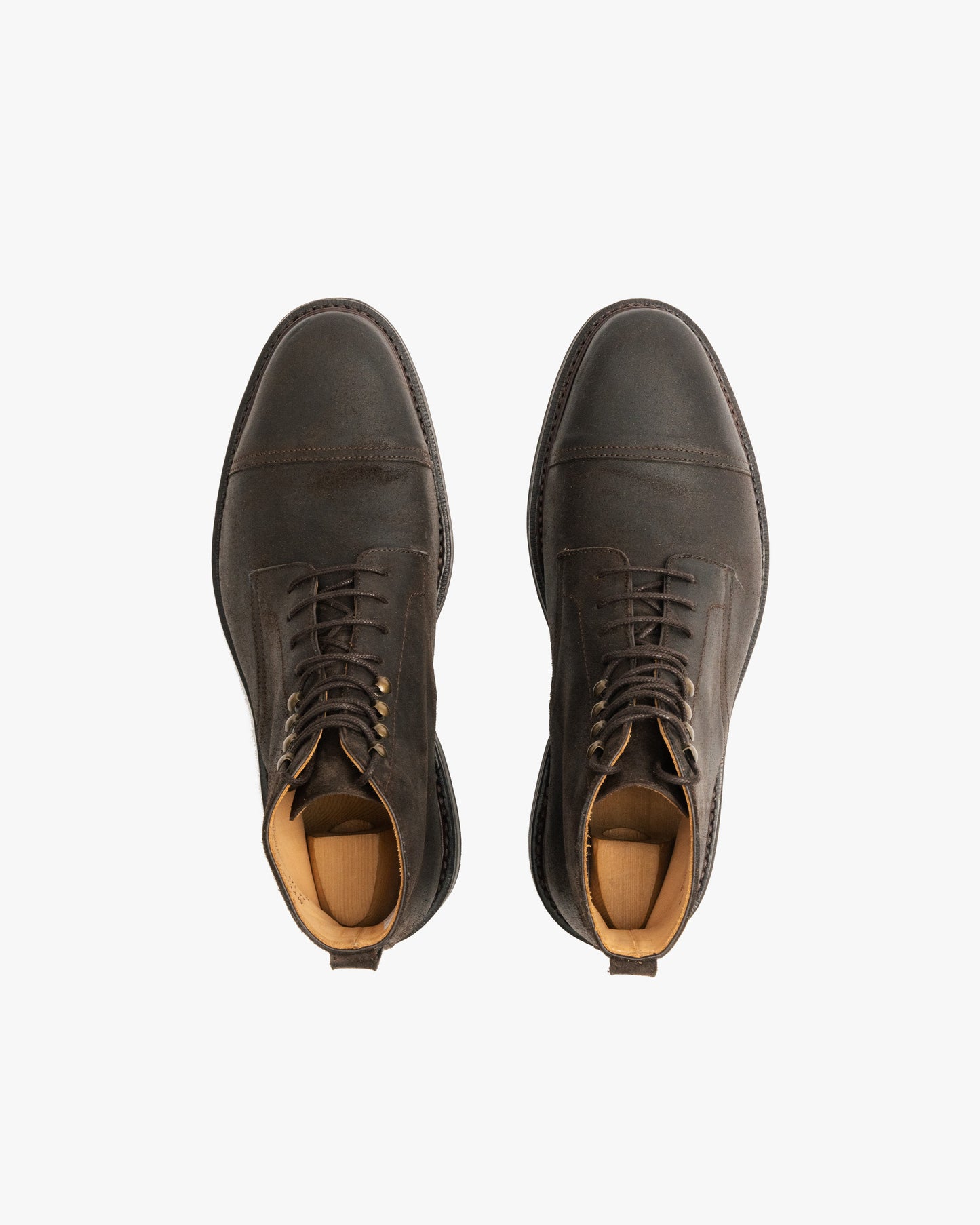 Top-down view of a pair of Abisko – Brown Waxed Suede boots against a white background.