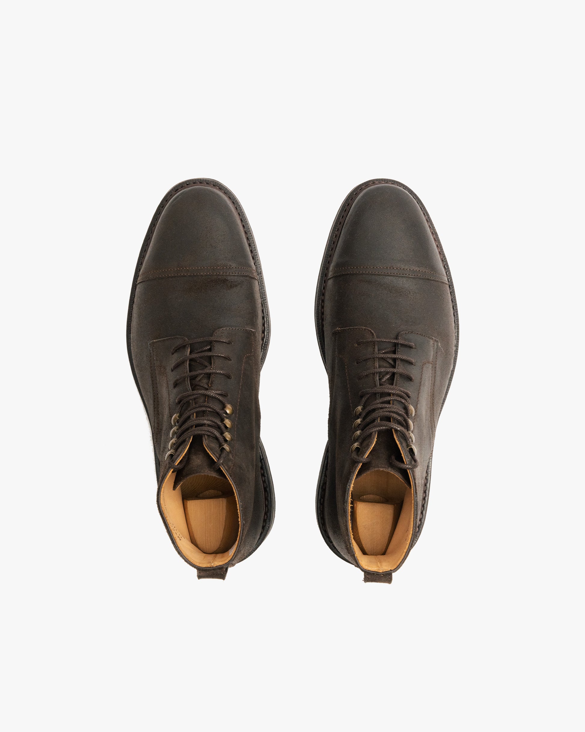 Top-down view of a pair of Abisko – Brown Waxed Suede boots against a white background.