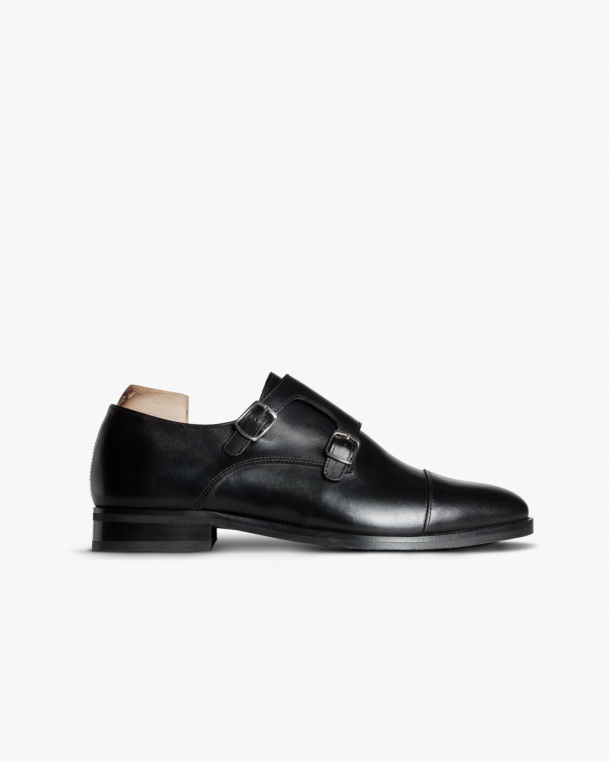 Ålsten II in black calf double monk strap shoe with silver buckles against a clean white background.