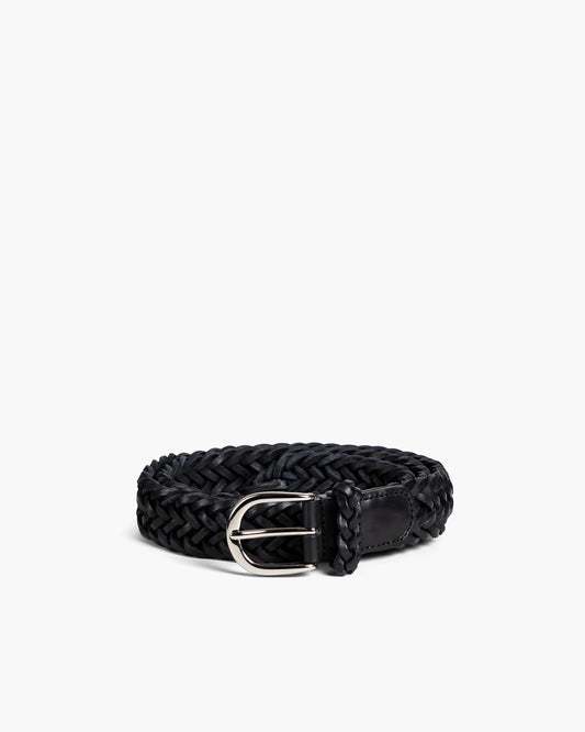 Studio shot of Belt – Braided Black Leather, coiled to display its intricate braided texture and polished silver buckle.