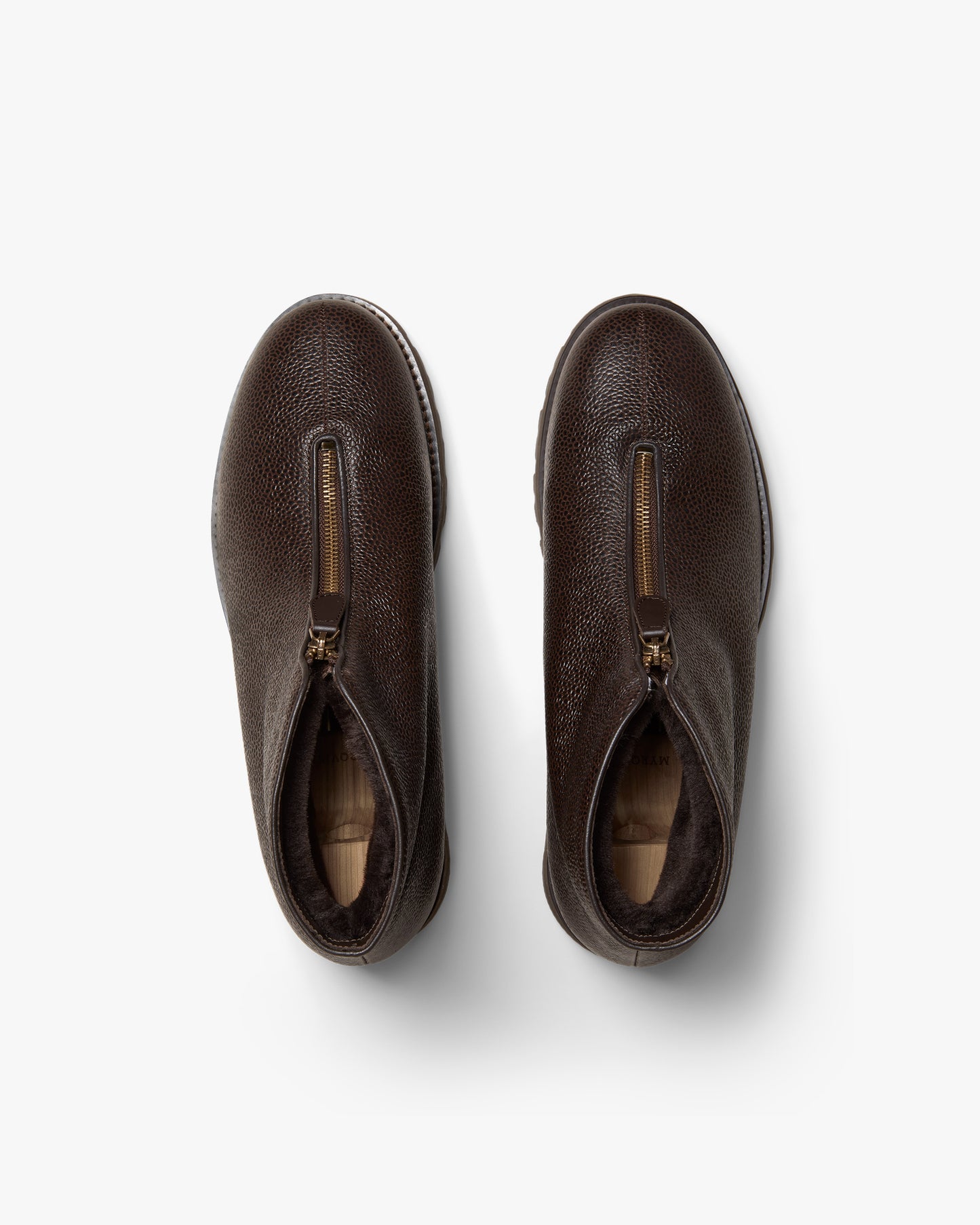 Top-down view of Funäs – Dark Brown Country Calf boots, showing the textured leather, zipper, and shearling lining.