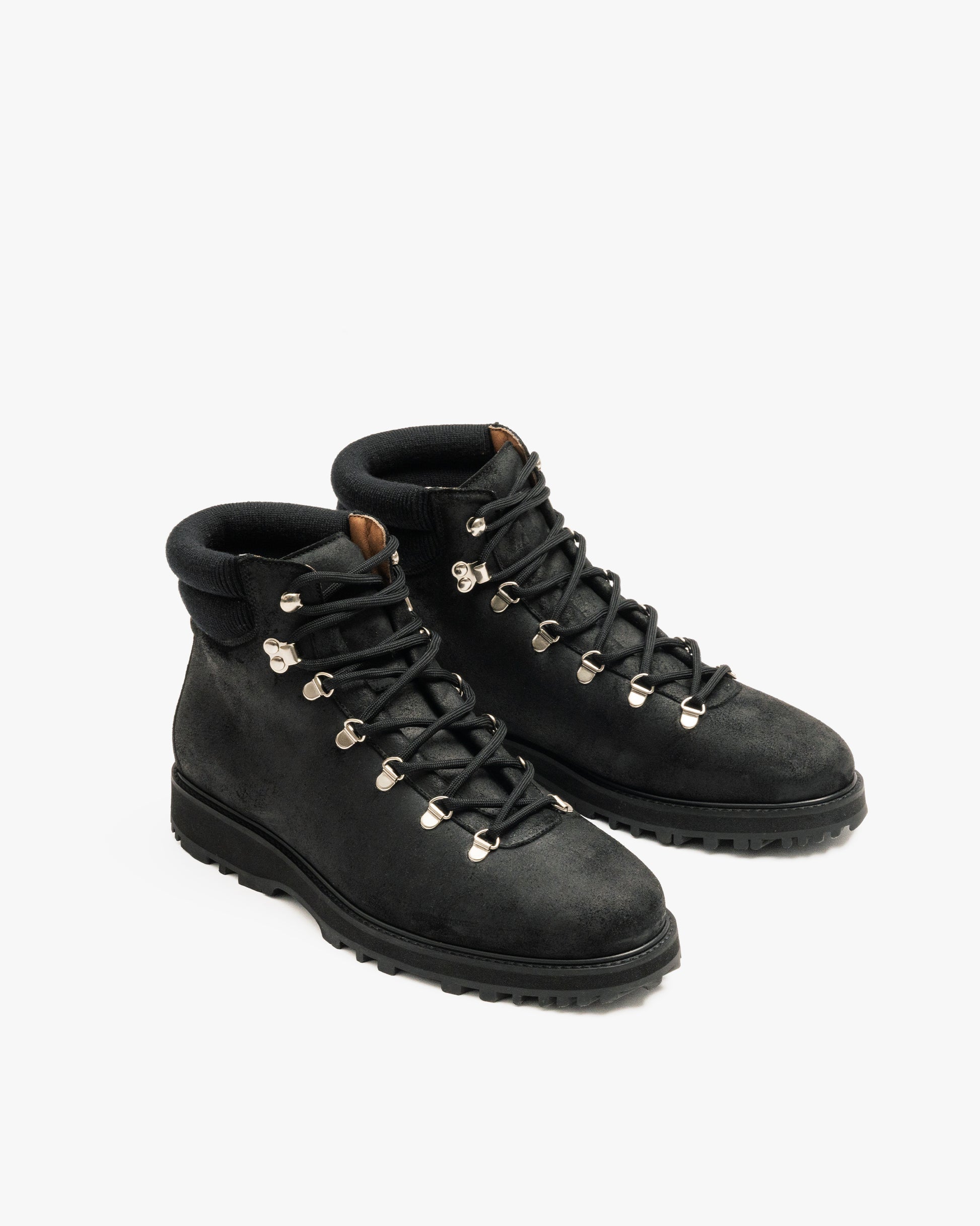 A pair of Duved II – Black Waxed Suede boots photographed against a white background.