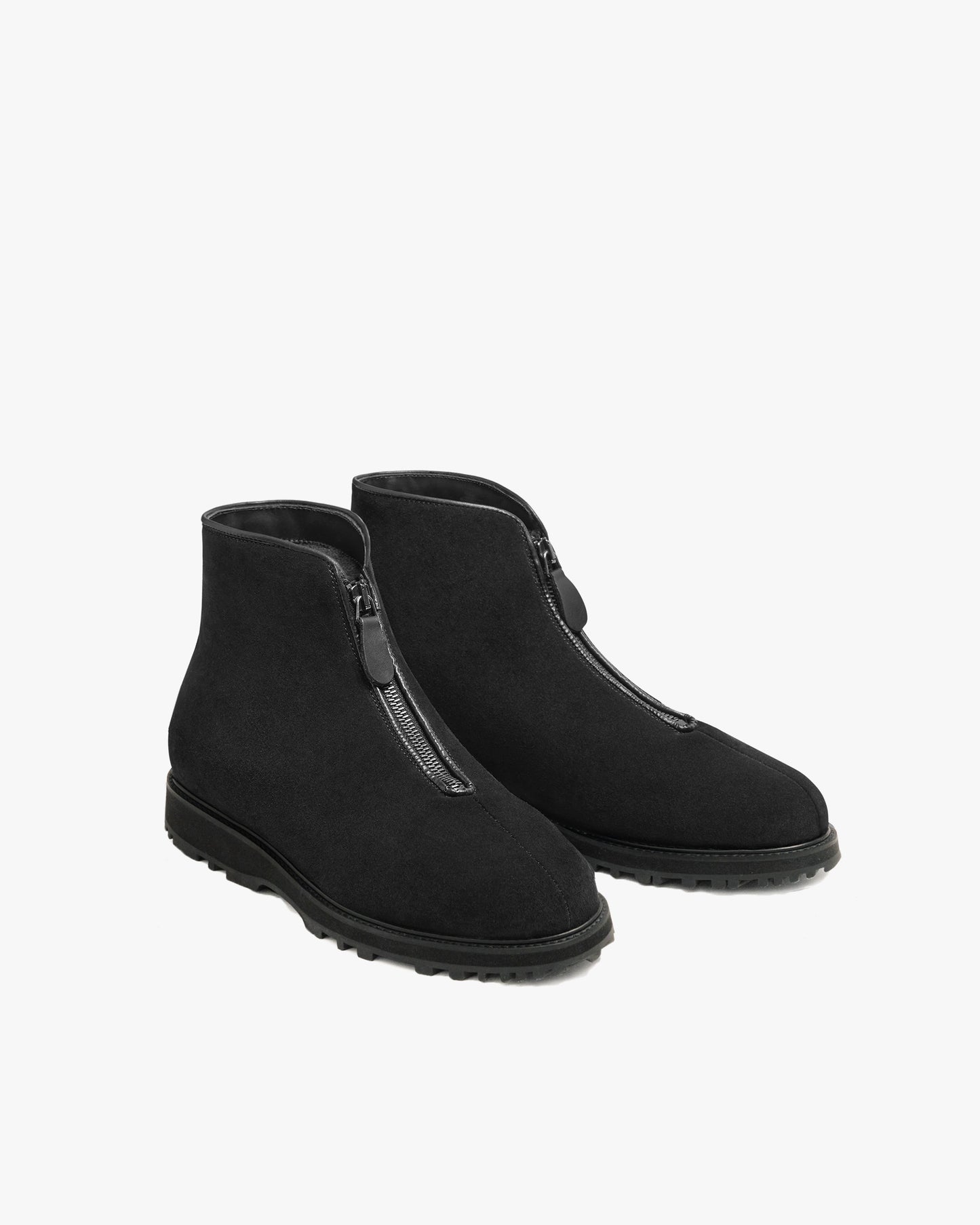 Funäs in black suede shown at an angle, featuring water-repellent suede uppers, central zip closures with leather pulls, and sturdy Explorer soles for versatile winter wear.