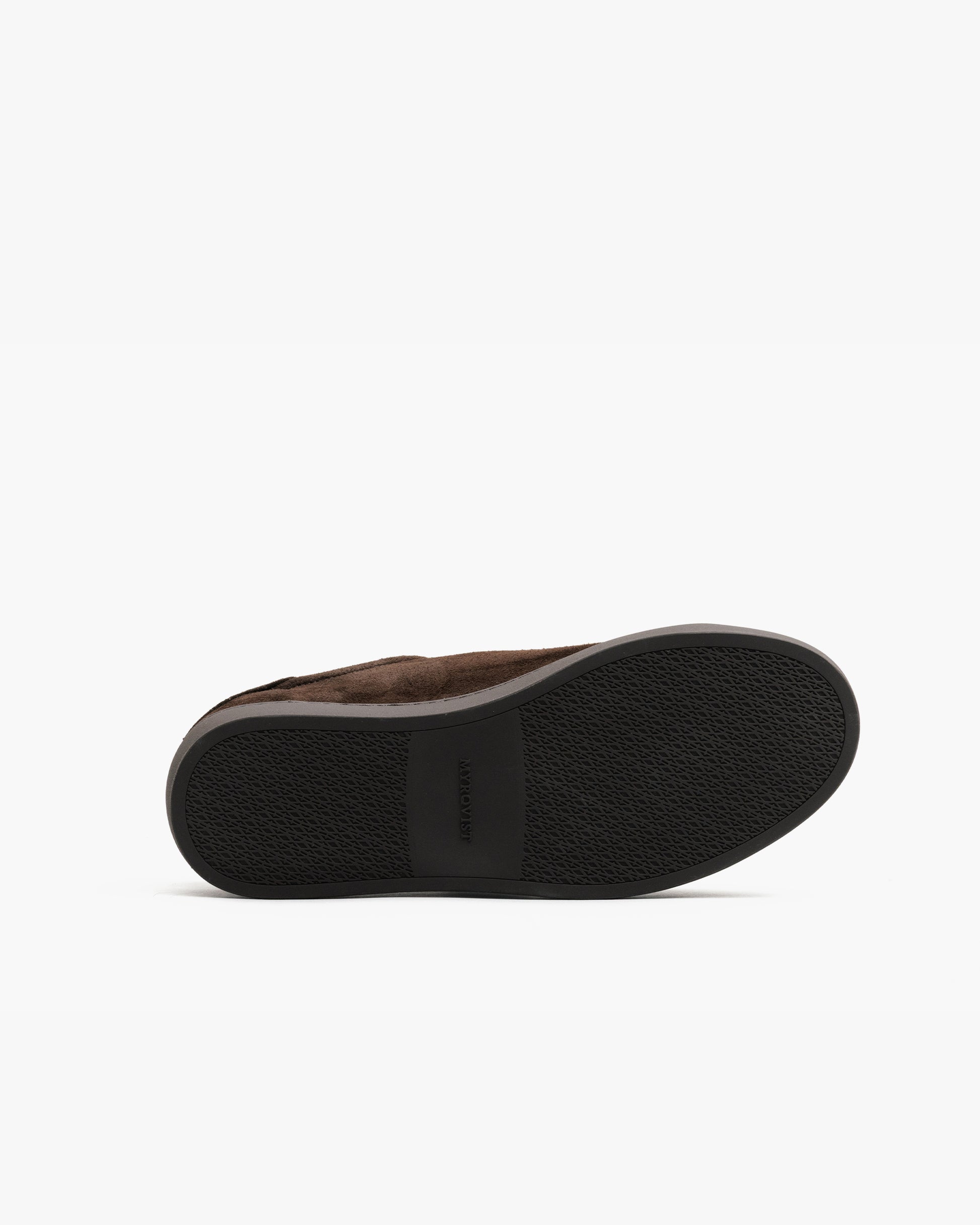 Alnö Monochrome II in dark brown suede shown from the sole, featuring a textured black rubber outsole with subtle branding for grip and durability.