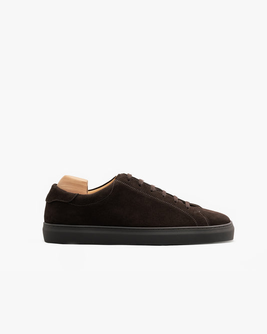 Oaxen Monochrome in dark brown suede shown in a side profile, featuring a smooth suede upper, matching laces, and a color-matched cup sole, with a wooden shoe tree inserted for shape.