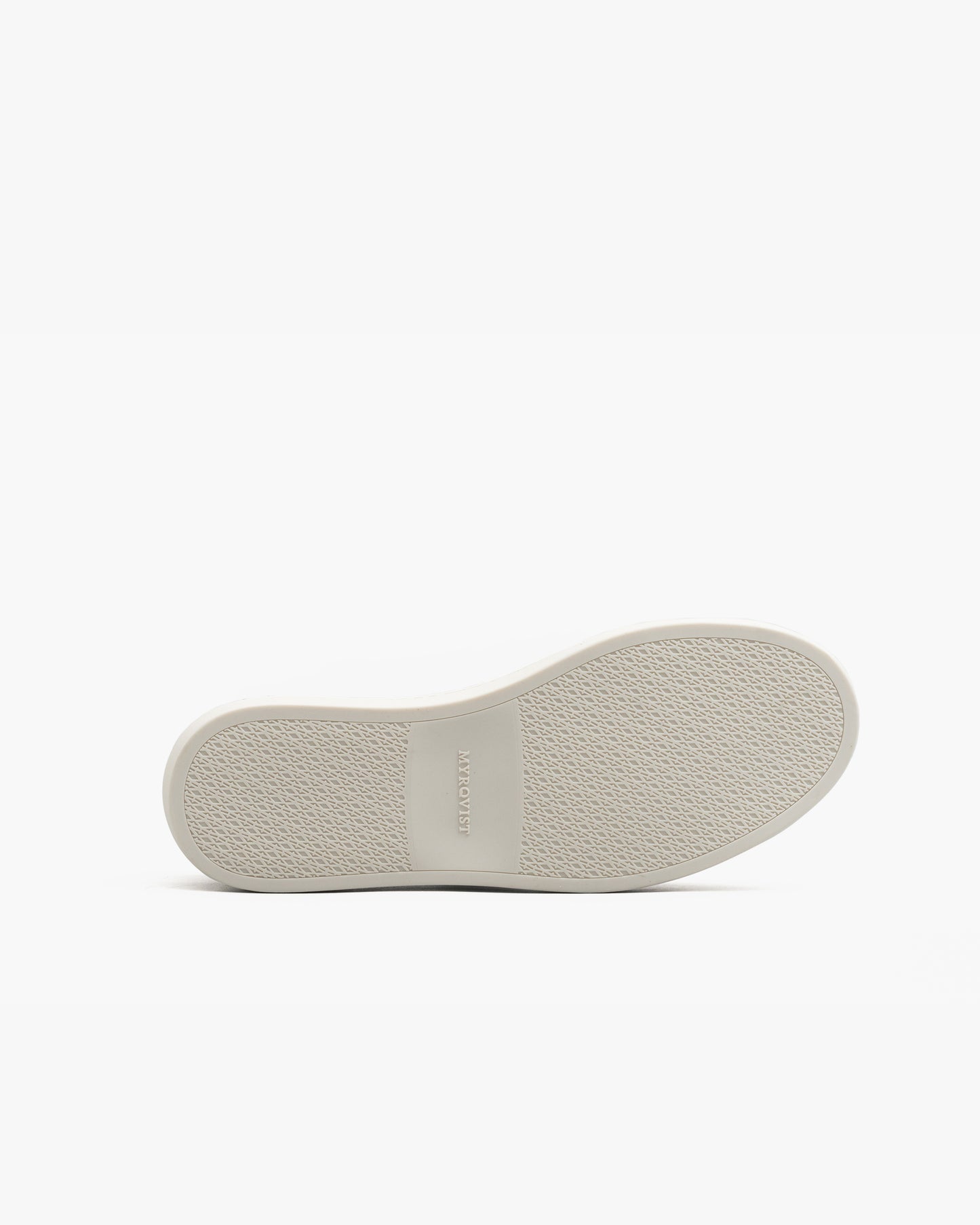 Close-up of the Oaxen in white calf showing the textured M-pattern rubber sole with MYRQVIST branding, designed for confident traction and everyday comfort.