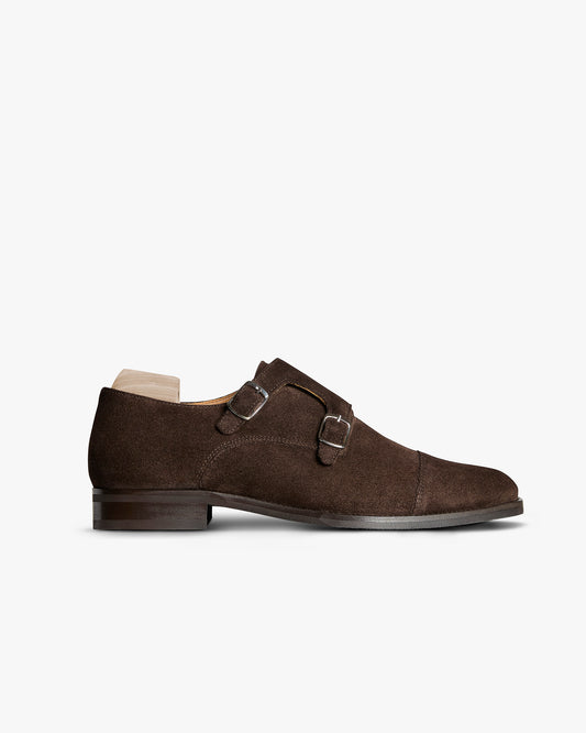 Ålsten II – Dark Brown Suede double monk strap shoe shown in side profile with silver-toned buckles.