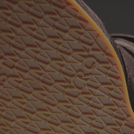 Stensund II – Dark Brown Suede sneaker showcasing soft dark brown suede and sporty mesh panels paired with tailored trousers.