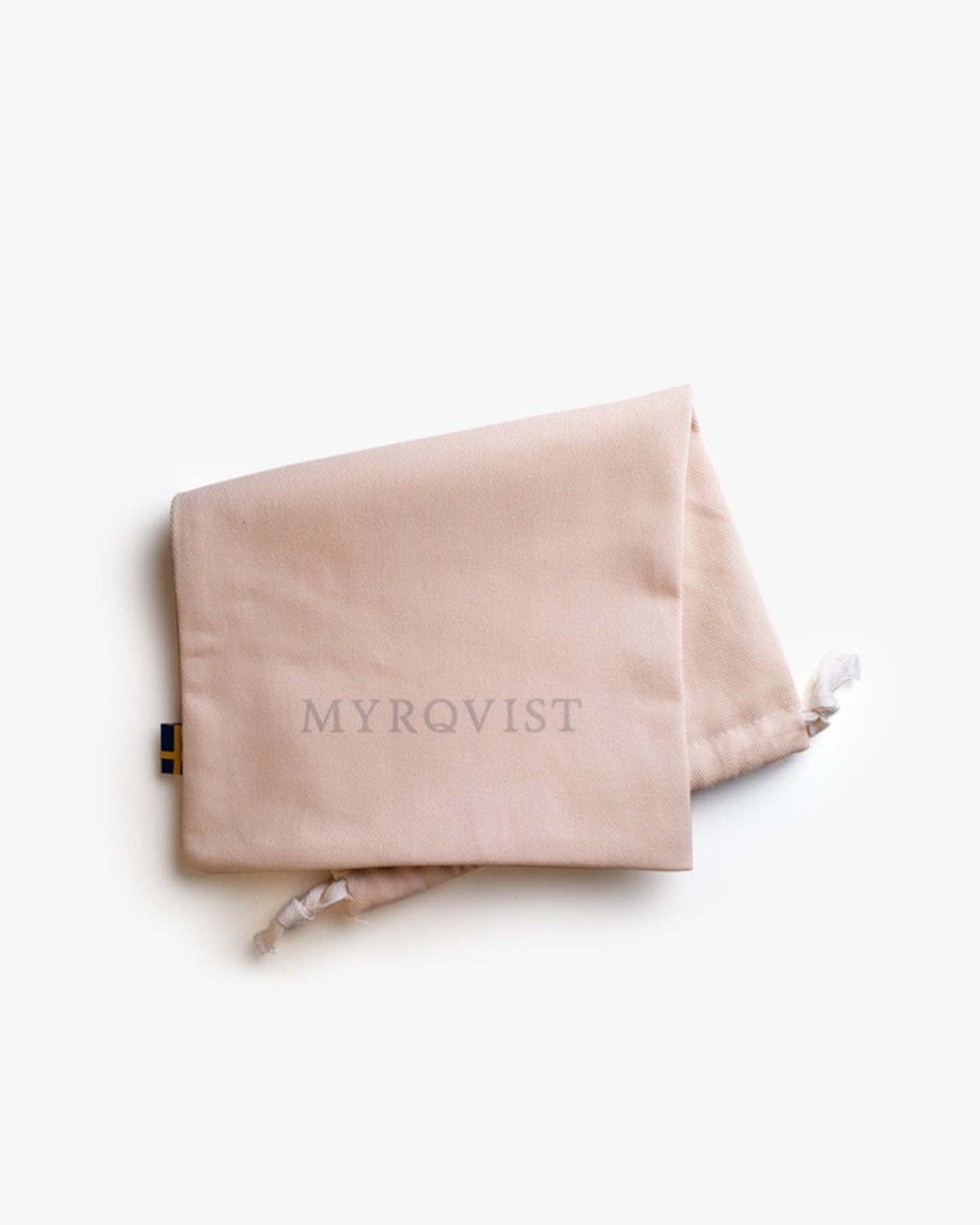 A beige Myrqvist dust bag with a drawstring closure, folded to display the brand logo against a white background.