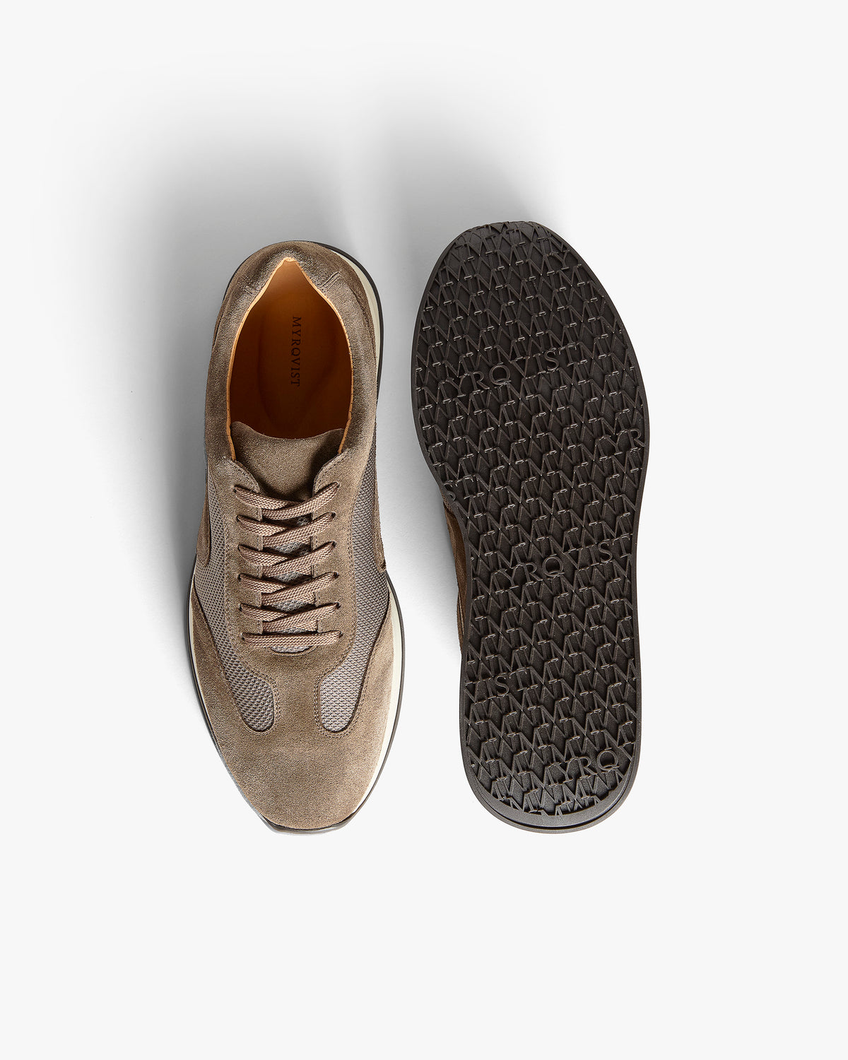 Stensund II – Taupe Suede shown from above with one shoe upright and one showing the patterned sole.